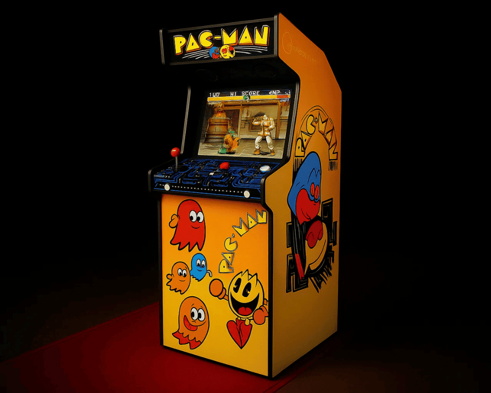 Pac-Man themed arcade cabinet with its screen on, on a red carpet