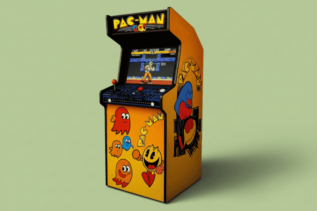 Pac-Man themed arcade cabinet in yellow and orange, with a retro fighting game on the screen