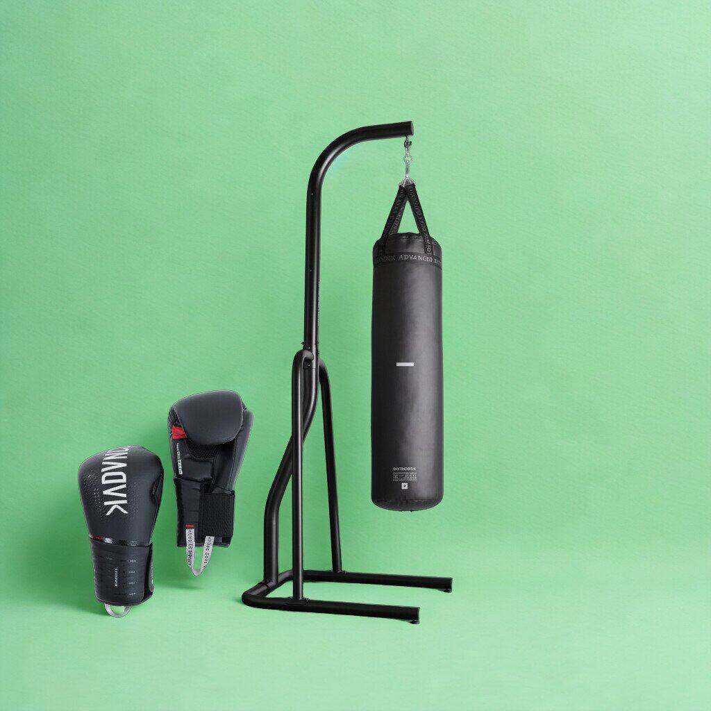 Black punching bag hanging from a freestanding steel stand, with a pair of boxing gloves next to it