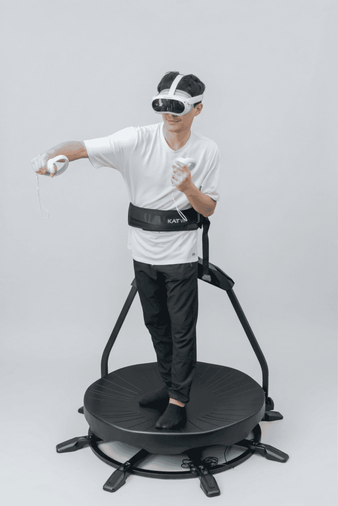 Visitor wearing a virtual reality headset on the KAT VR omnidirectional treadmill, a booth attraction for rent in Marrakech